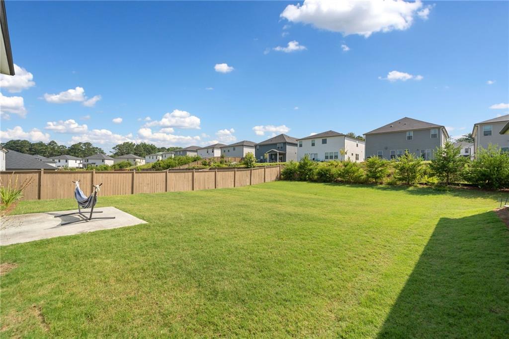 368 Murray Way Lilburn, GA 30047 - Photo 39 of 54 a view of a house with a yard and lake view