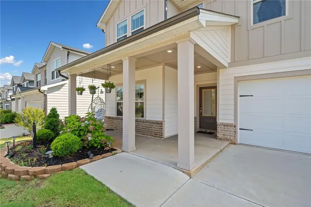 an aerial view of a house with a garden and swimming pool
