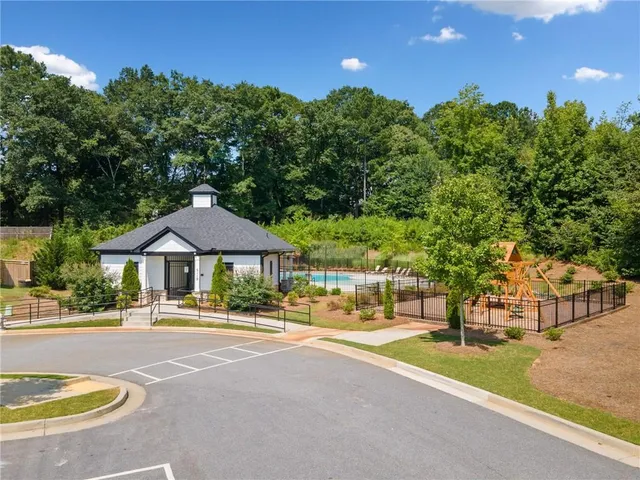 a view of a swimming pool with a patio