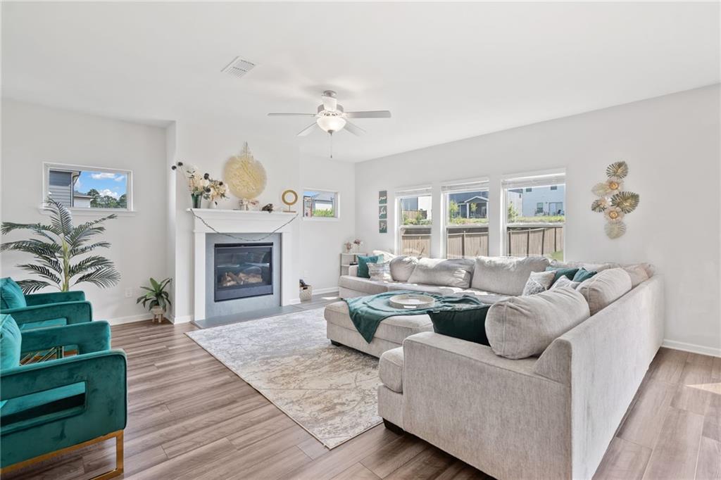 368 Murray Way Lilburn, GA 30047 - Photo 6 of 54 a living room with furniture and a fireplace