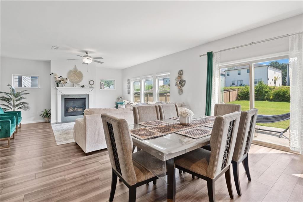 368 Murray Way Lilburn, GA 30047 - Photo 10 of 54 a view of a dining room with furniture window and wooden floor