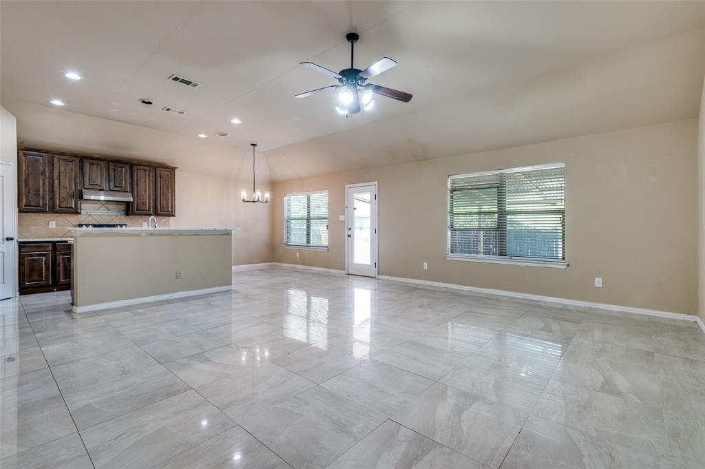 1615 Ridgemar Drive Grand Prairie, TX 75051 - Photo 13 of 25 a view of an empty room with a kitchen