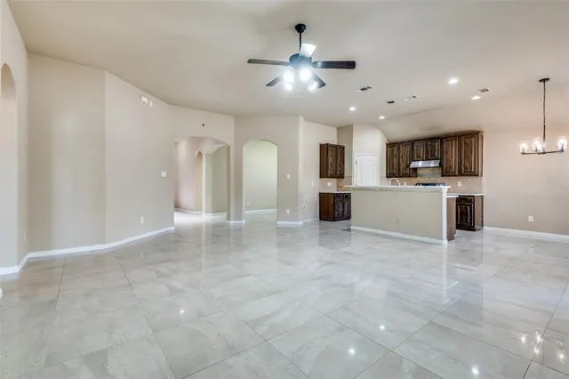a view of a kitchen with a sink and a chandelier