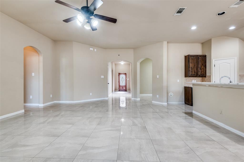 1615 Ridgemar Drive Grand Prairie, TX 75051 - Photo 16 of 25 a view of a kitchen with a sink and a chandelier
