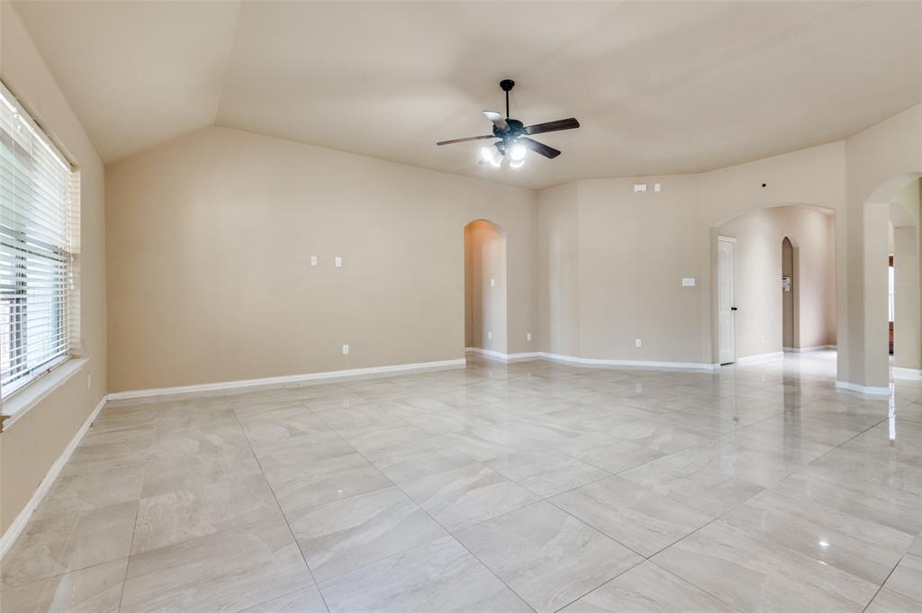 1615 Ridgemar Drive Grand Prairie, TX 75051 - Photo 17 of 25 an empty room with fan and windows