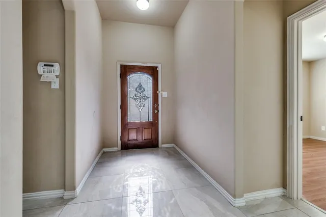 a bathroom with a glass door shower