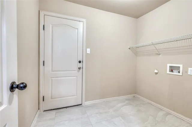 a view of a porch with a table and chairs