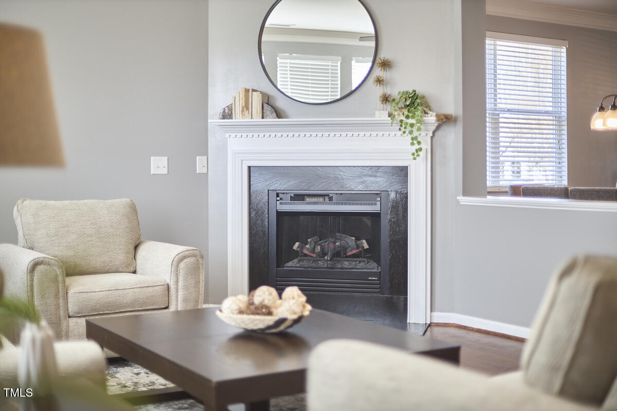 442 Steel Hopper Way Garner, NC 27529 - Photo 10 of 45 a living room with furniture and a fireplace