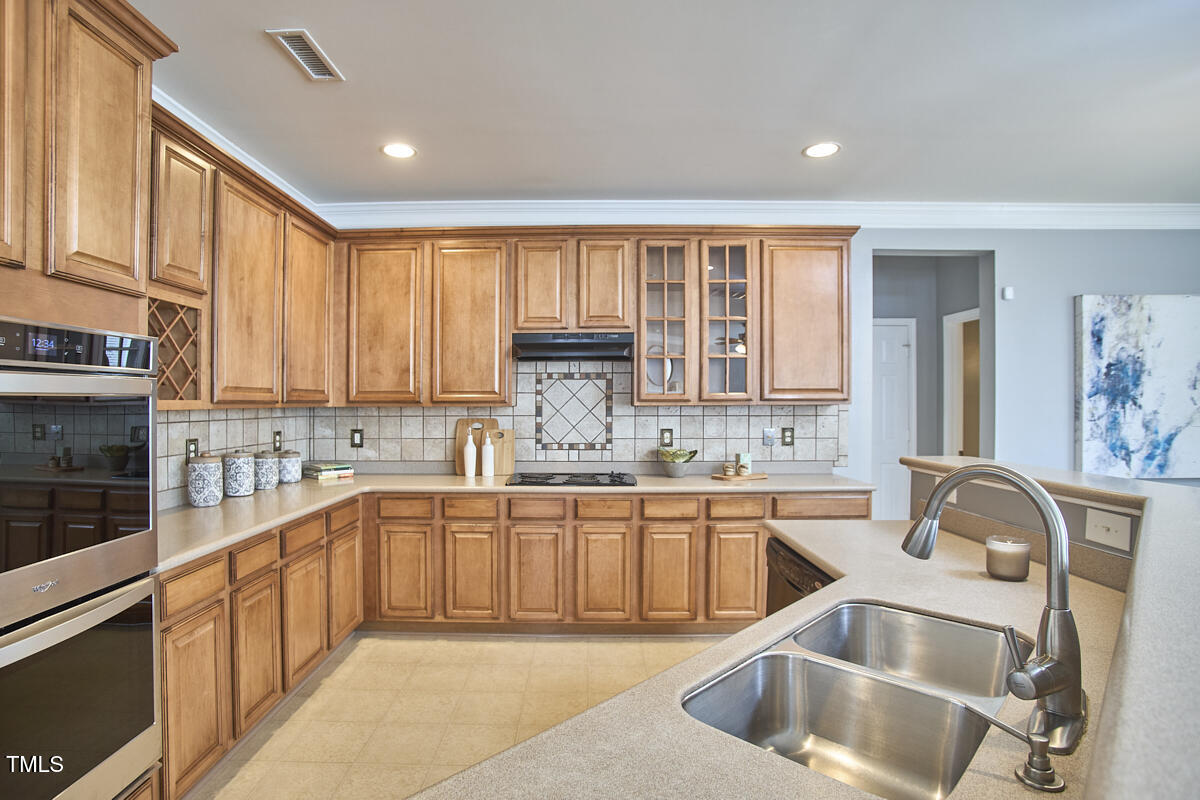 442 Steel Hopper Way Garner, NC 27529 - Photo 15 of 45 a kitchen with a sink cabinets and window
