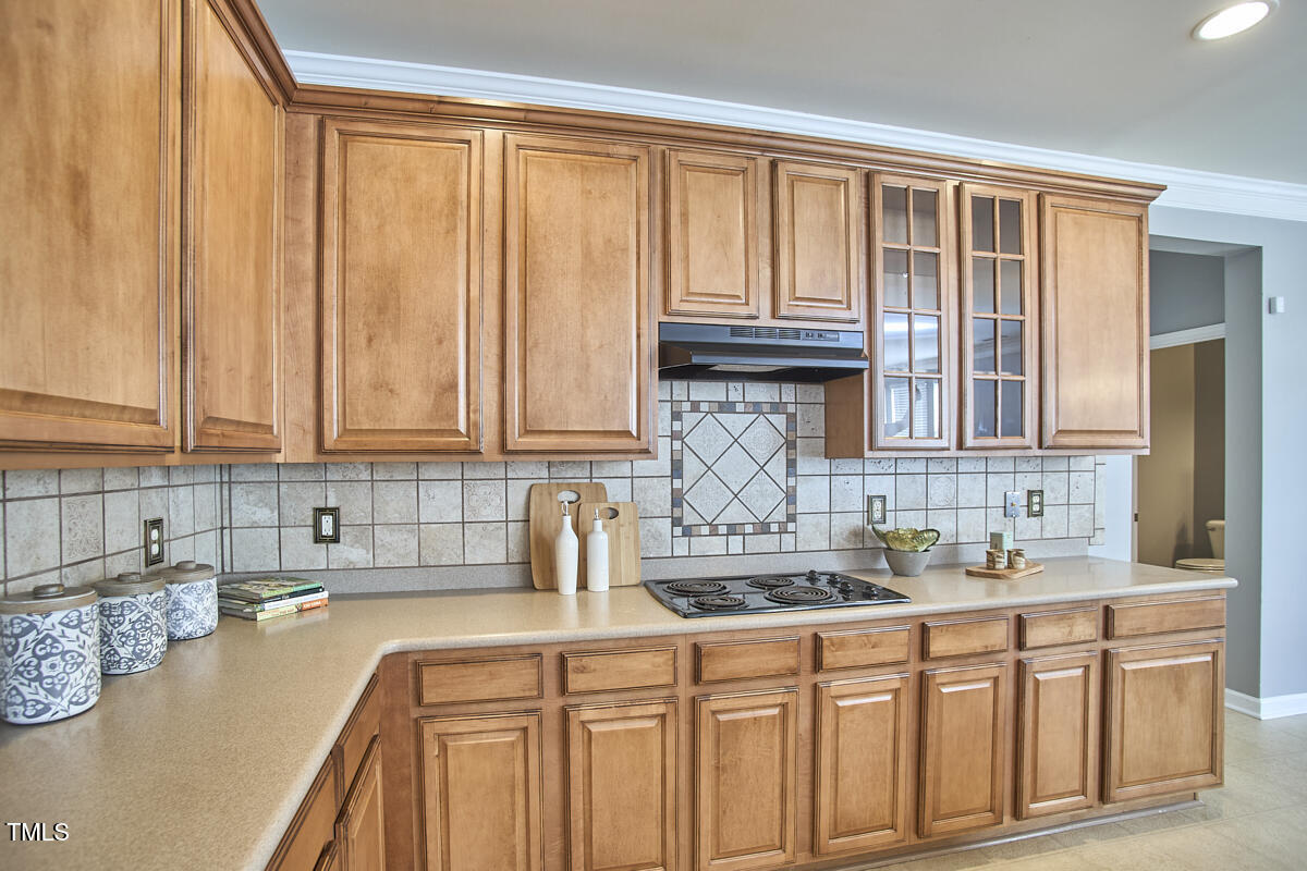 442 Steel Hopper Way Garner, NC 27529 - Photo 16 of 45 a kitchen with stainless steel appliances granite countertop a sink a stove and cabinets