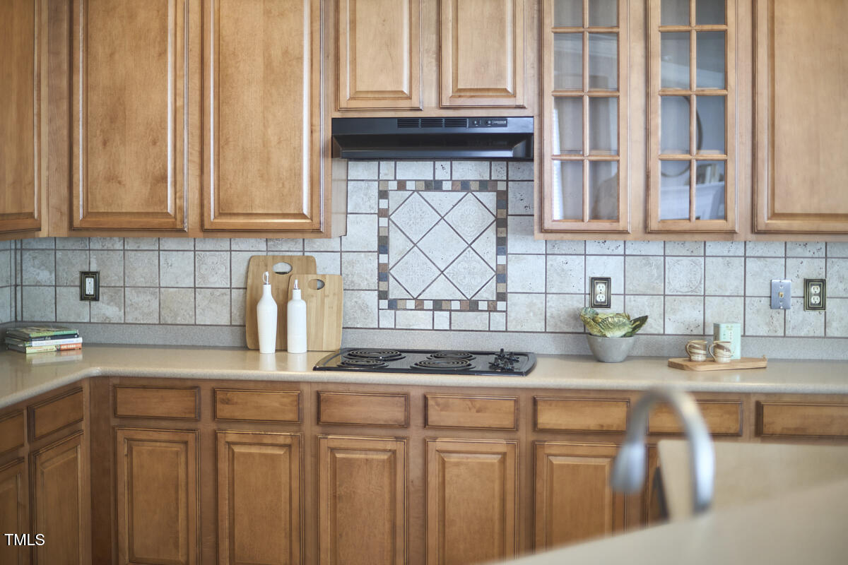 442 Steel Hopper Way Garner, NC 27529 - Photo 17 of 45 a kitchen with stainless steel appliances granite countertop a sink and a white cabinets