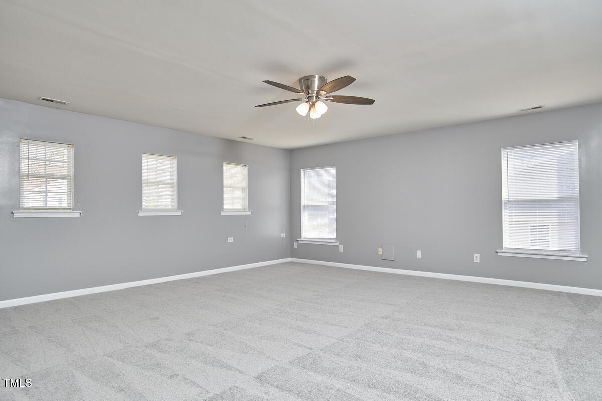 442 Steel Hopper Way Garner, NC 27529 - Photo 23 of 45 a view of an empty room with a window