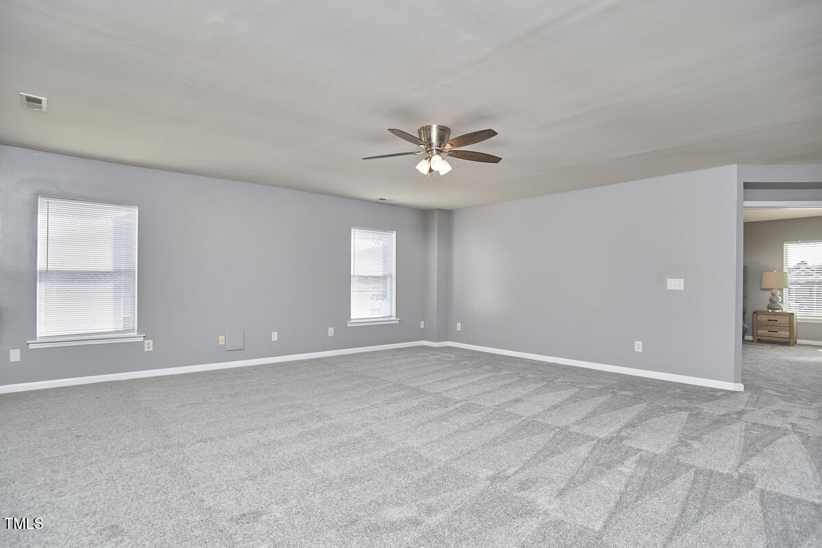 442 Steel Hopper Way Garner, NC 27529 - Photo 24 of 45 a view of an empty room with a window