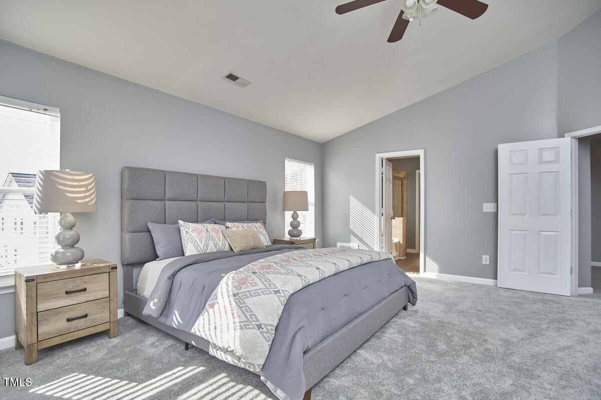 442 Steel Hopper Way Garner, NC 27529 - Photo 26 of 45 a bedroom with a bed and a view of bedroom