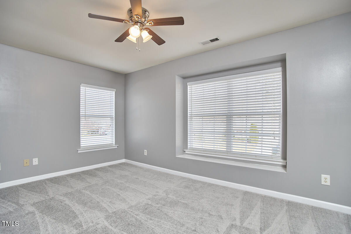442 Steel Hopper Way Garner, NC 27529 - Photo 36 of 45 a view of an empty room with a window