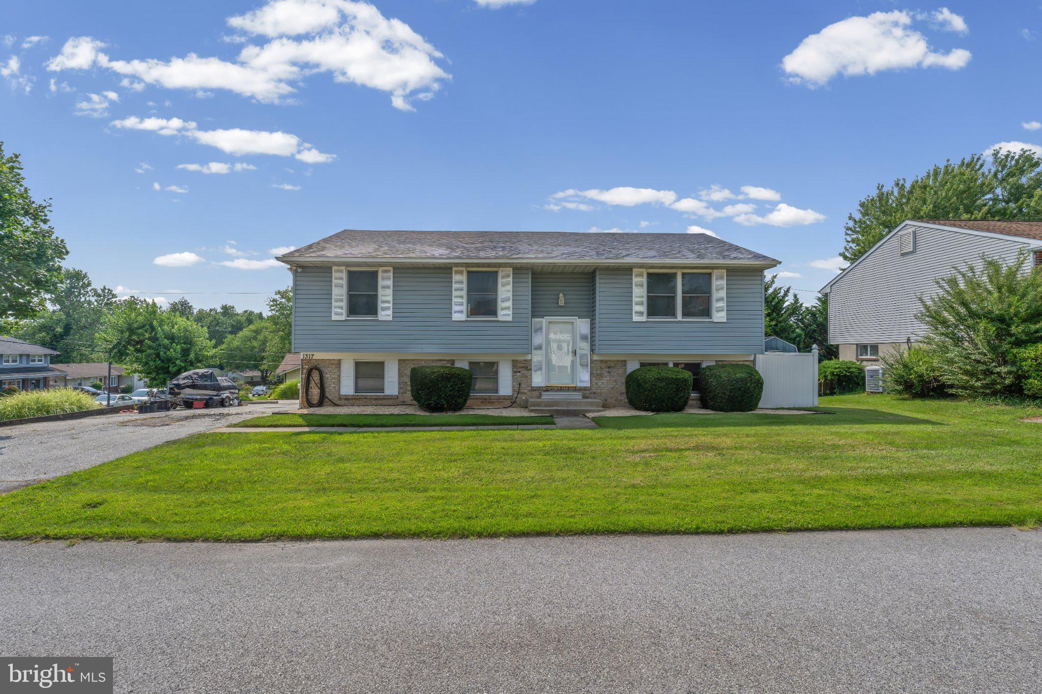 1317 Roxboro Road Baltimore, MD 21237 - Photo 2 of 30 Charming split-level home with lush lawn.