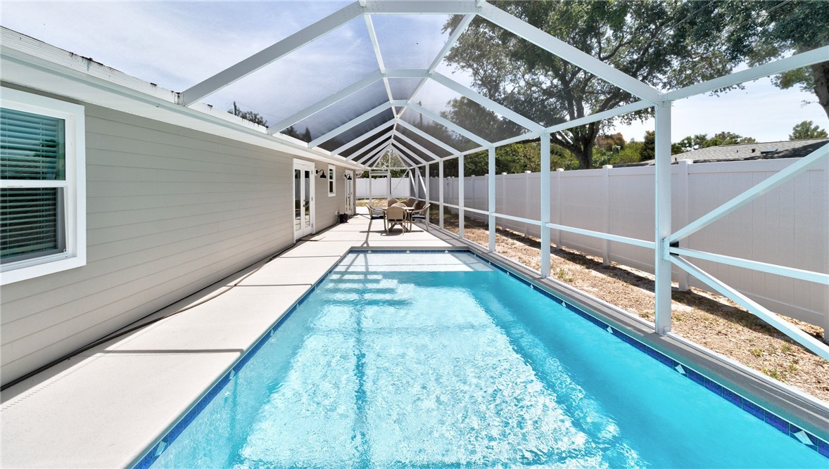 7989 143rd Street Sebastian, FL 32958 - Photo 1 of 30 a view of swimming pool with a outdoor seating