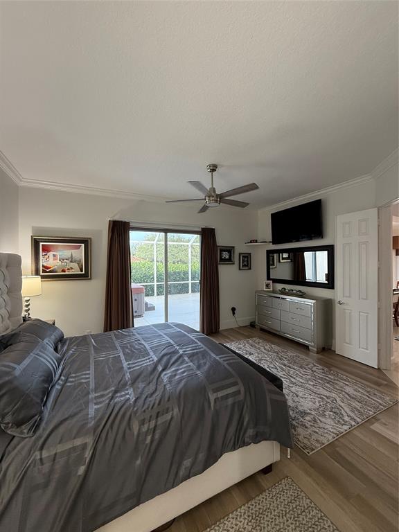 2752 Irma Lake Drive West Palm Beach, FL 33411 - Photo 22 of 38 a bedroom with a bed and a tv