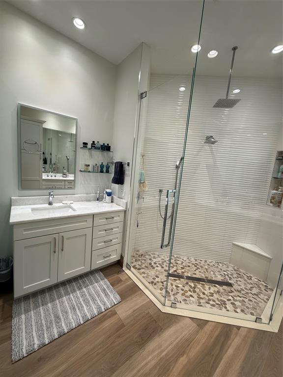 2752 Irma Lake Drive West Palm Beach, FL 33411 - Photo 27 of 38 a bathroom with a sink a mirror and a shower