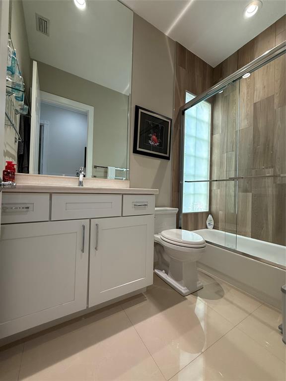 2752 Irma Lake Drive West Palm Beach, FL 33411 - Photo 30 of 38 a bathroom with a sink toilet and tub