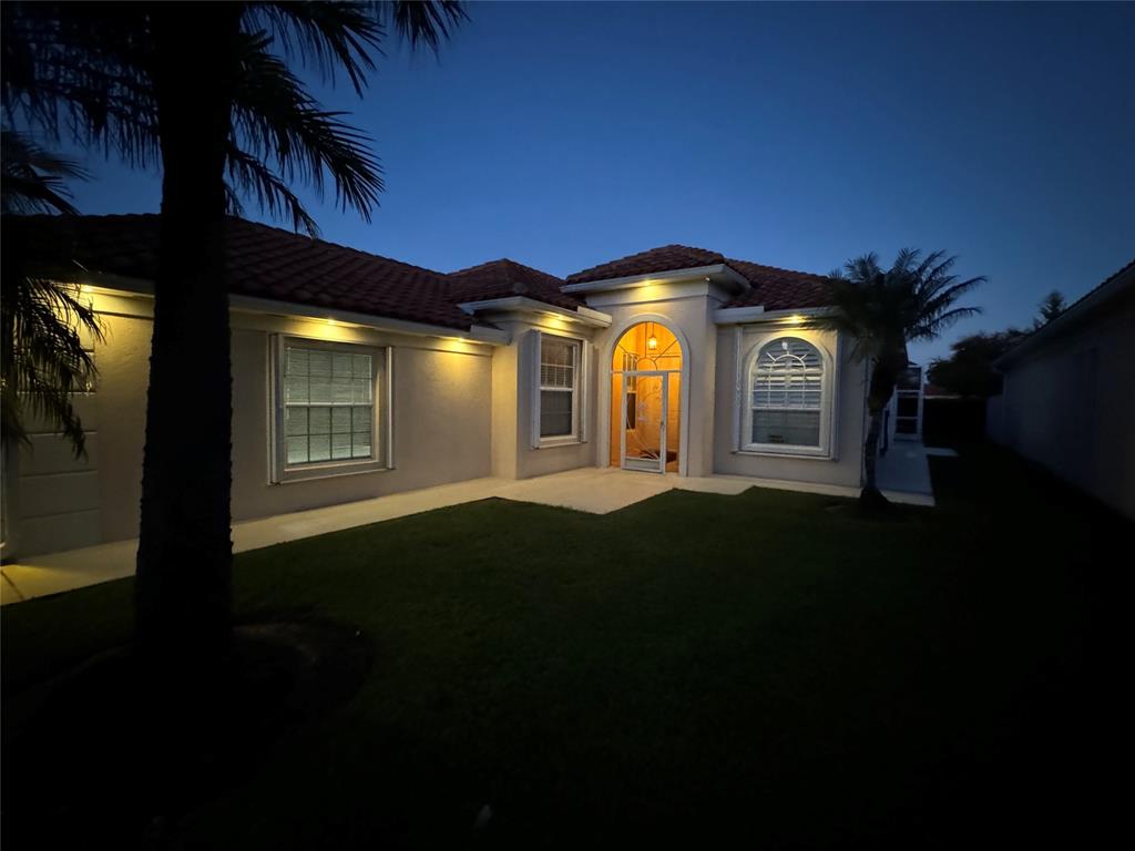 2752 Irma Lake Drive West Palm Beach, FL 33411 - Photo 3 of 38 a front view of a house