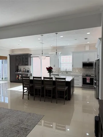 a kitchen with a table and chairs in it