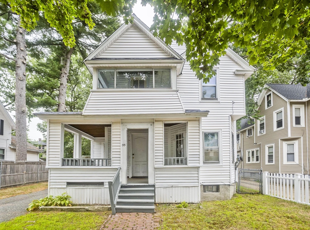 33 Forest Street Springfield, MA 01108 - Photo 1 of 39 a front view of a house with a yard
