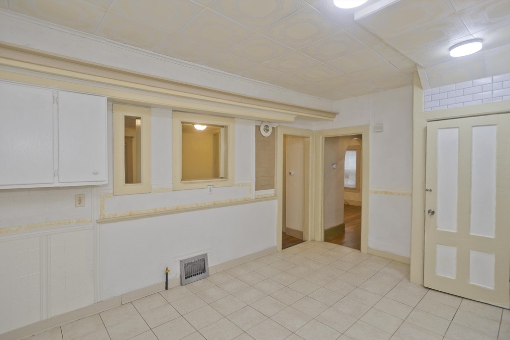 33 Forest Street Springfield, MA 01108 - Photo 11 of 39 a view of an empty room and window