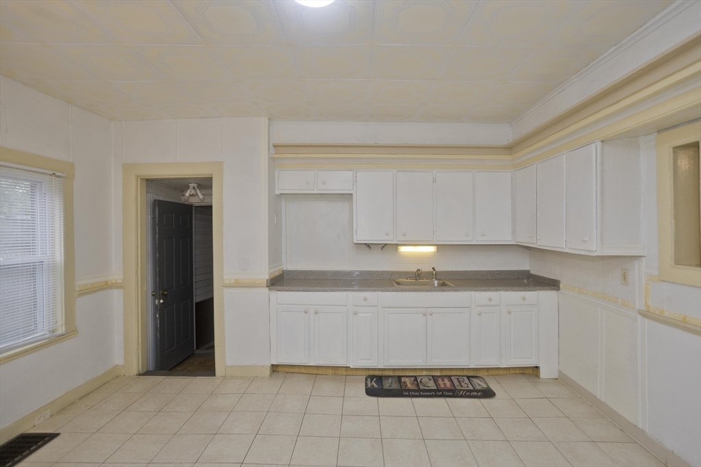 33 Forest Street Springfield, MA 01108 - Photo 12 of 39 a kitchen with a sink a cabinets and window