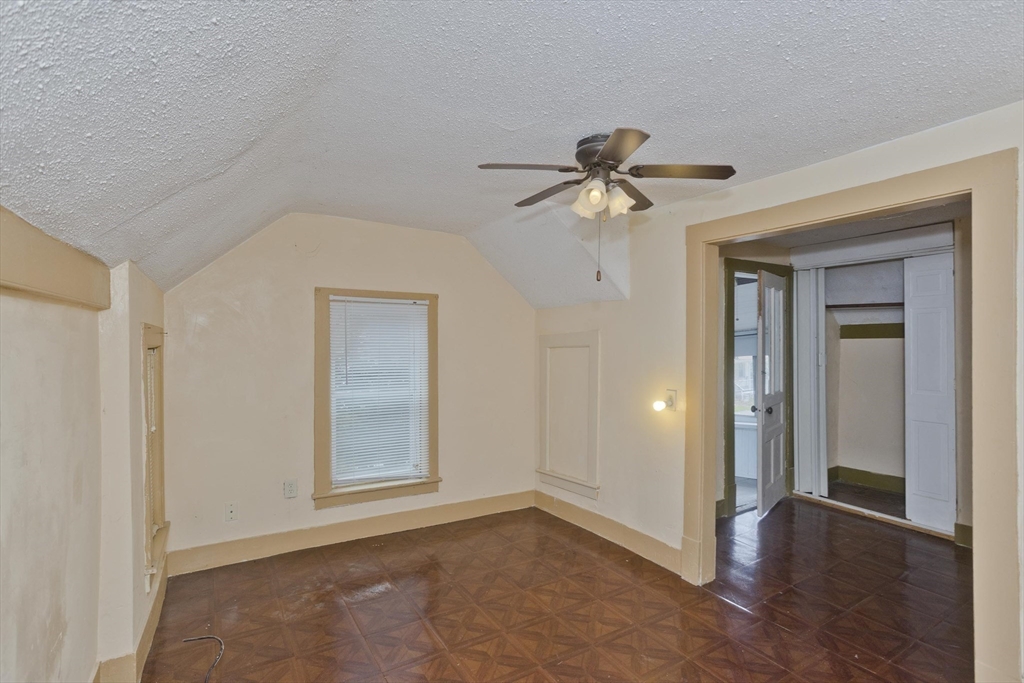 33 Forest Street Springfield, MA 01108 - Photo 14 of 39 wooden floor in an empty room with a window