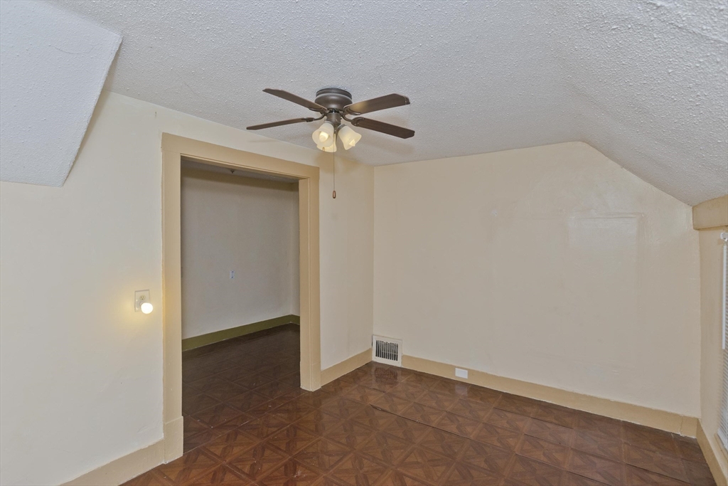 33 Forest Street Springfield, MA 01108 - Photo 15 of 39 wooden floor in an empty room