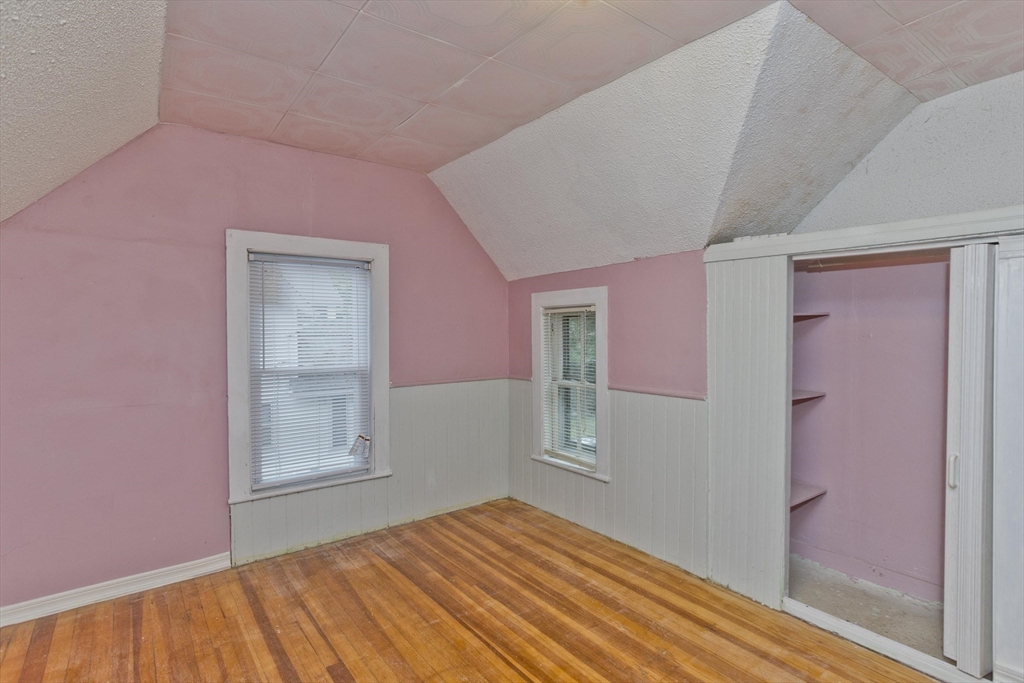33 Forest Street Springfield, MA 01108 - Photo 18 of 39 a view of empty room with window and wooden floor