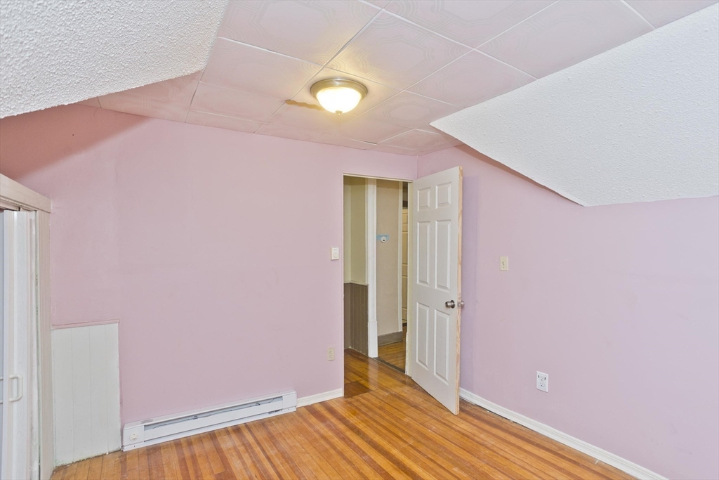 33 Forest Street Springfield, MA 01108 - Photo 19 of 39 a view of a livingroom with wooden floor and a bathroom