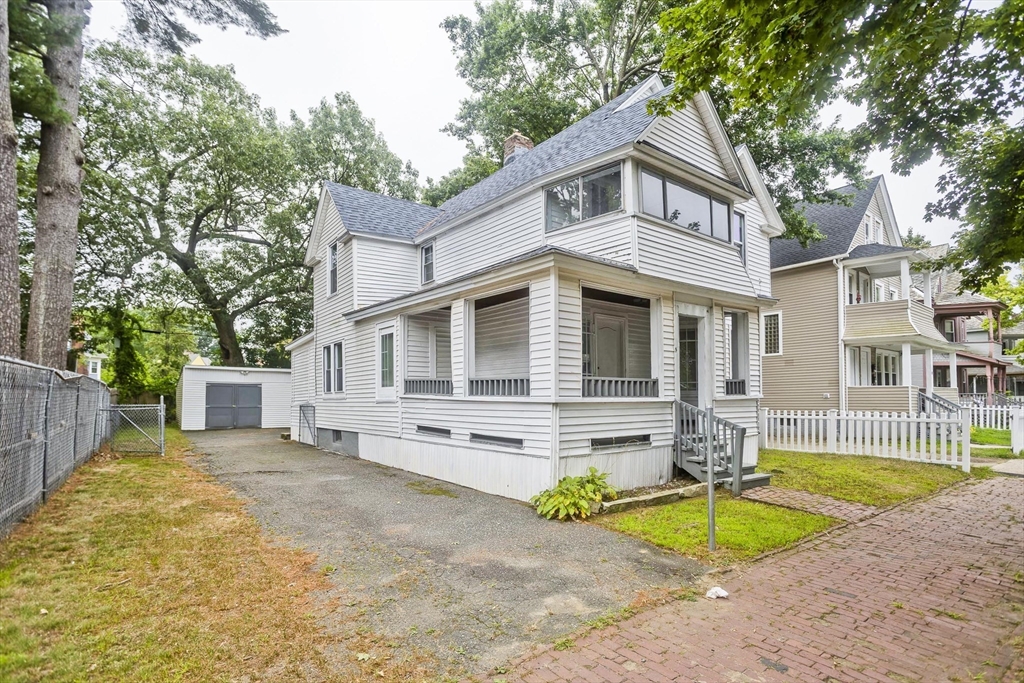 33 Forest Street Springfield, MA 01108 - Photo 2 of 39 a front view of a house with garden