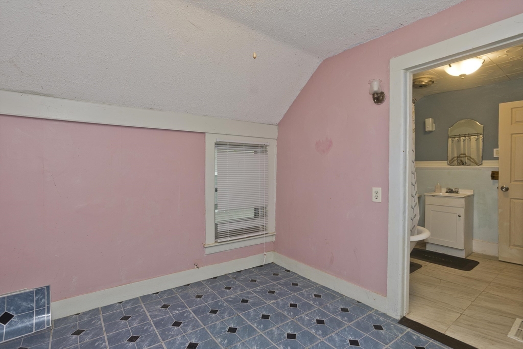 33 Forest Street Springfield, MA 01108 - Photo 24 of 39 a view of a livingroom with wooden floor and a bathroom