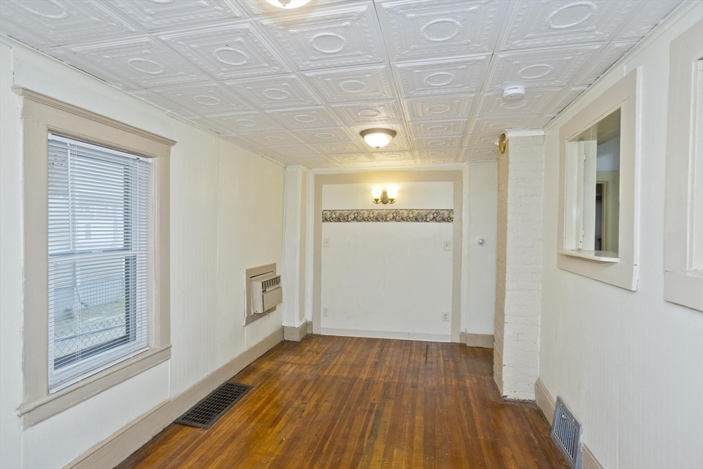 33 Forest Street Springfield, MA 01108 - Photo 31 of 39 a view of an empty room with wooden floor and a window