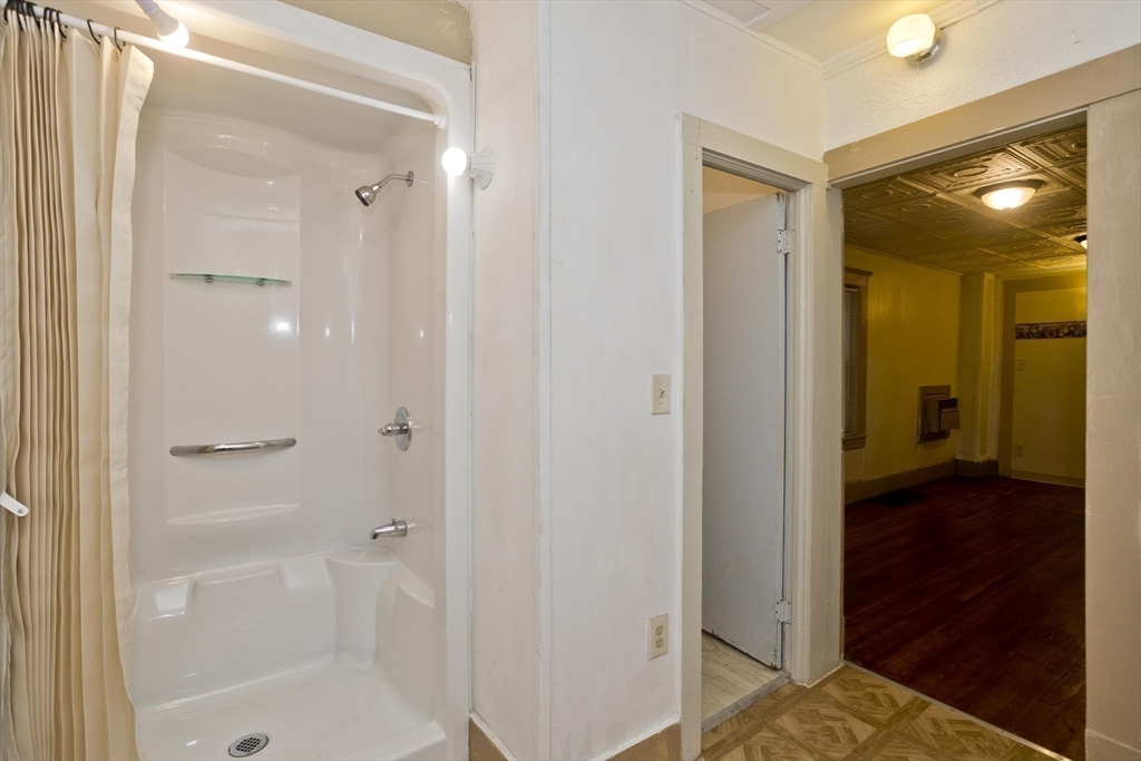 33 Forest Street Springfield, MA 01108 - Photo 33 of 39 a bathroom with a shower and a tub