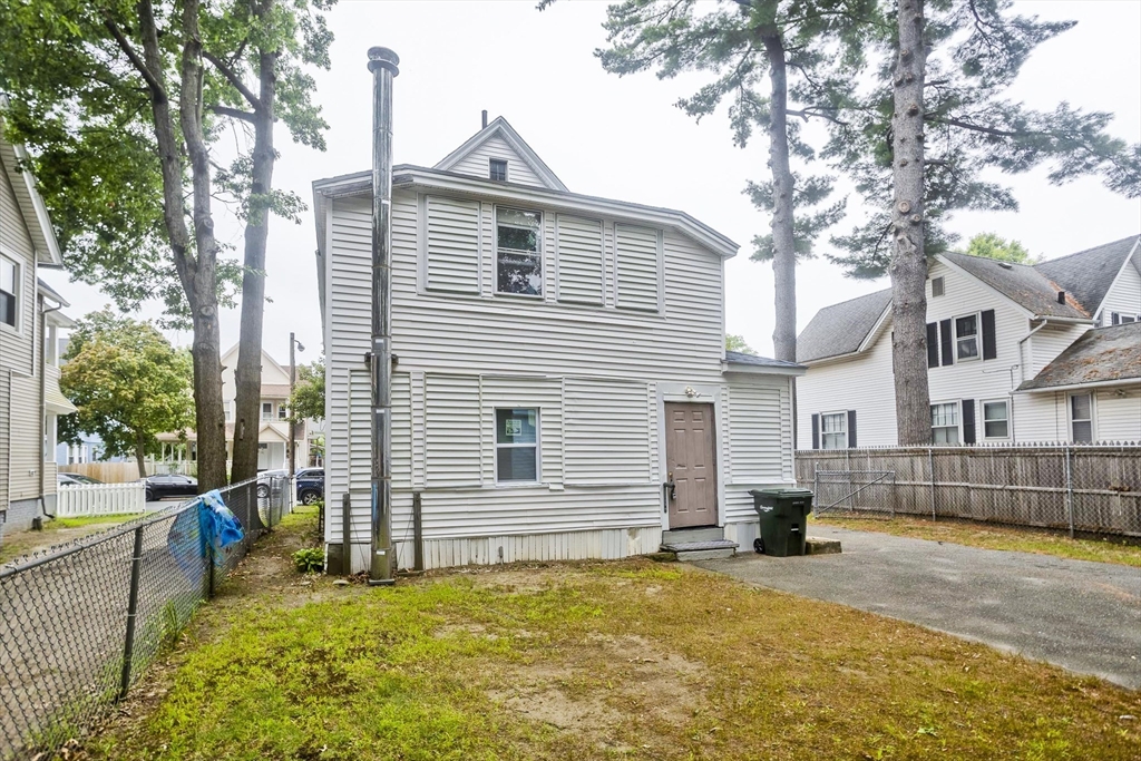 33 Forest Street Springfield, MA 01108 - Photo 38 of 39 a view of a house with a yard and large tree