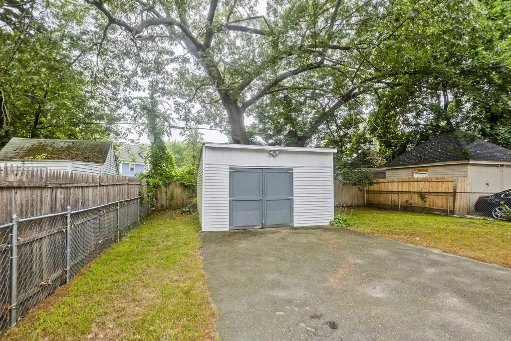 33 Forest Street Springfield, MA 01108 - Photo 39 of 39 a view of a backyard with a small cabin
