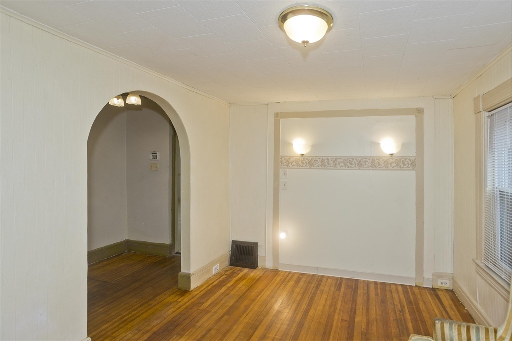 33 Forest Street Springfield, MA 01108 - Photo 4 of 39 a view of empty room with wooden floor