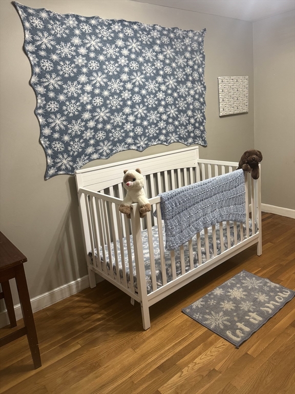 441 Grove Street Braintree, MA 02184 - Photo 2 of 13 a view of a wooden bench in a balcony