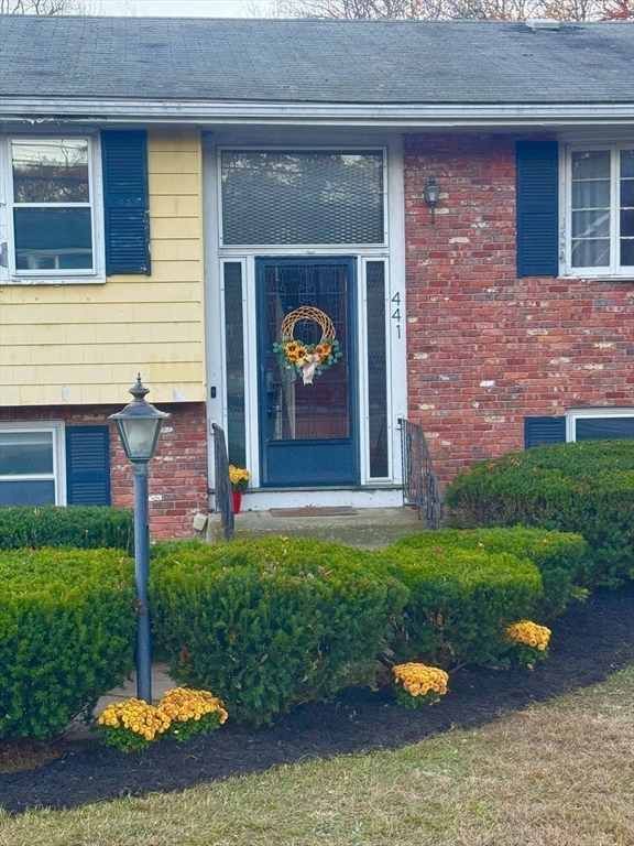 441 Grove Street Braintree, MA 02184 - Photo 10 of 13 a front view of a house with garden