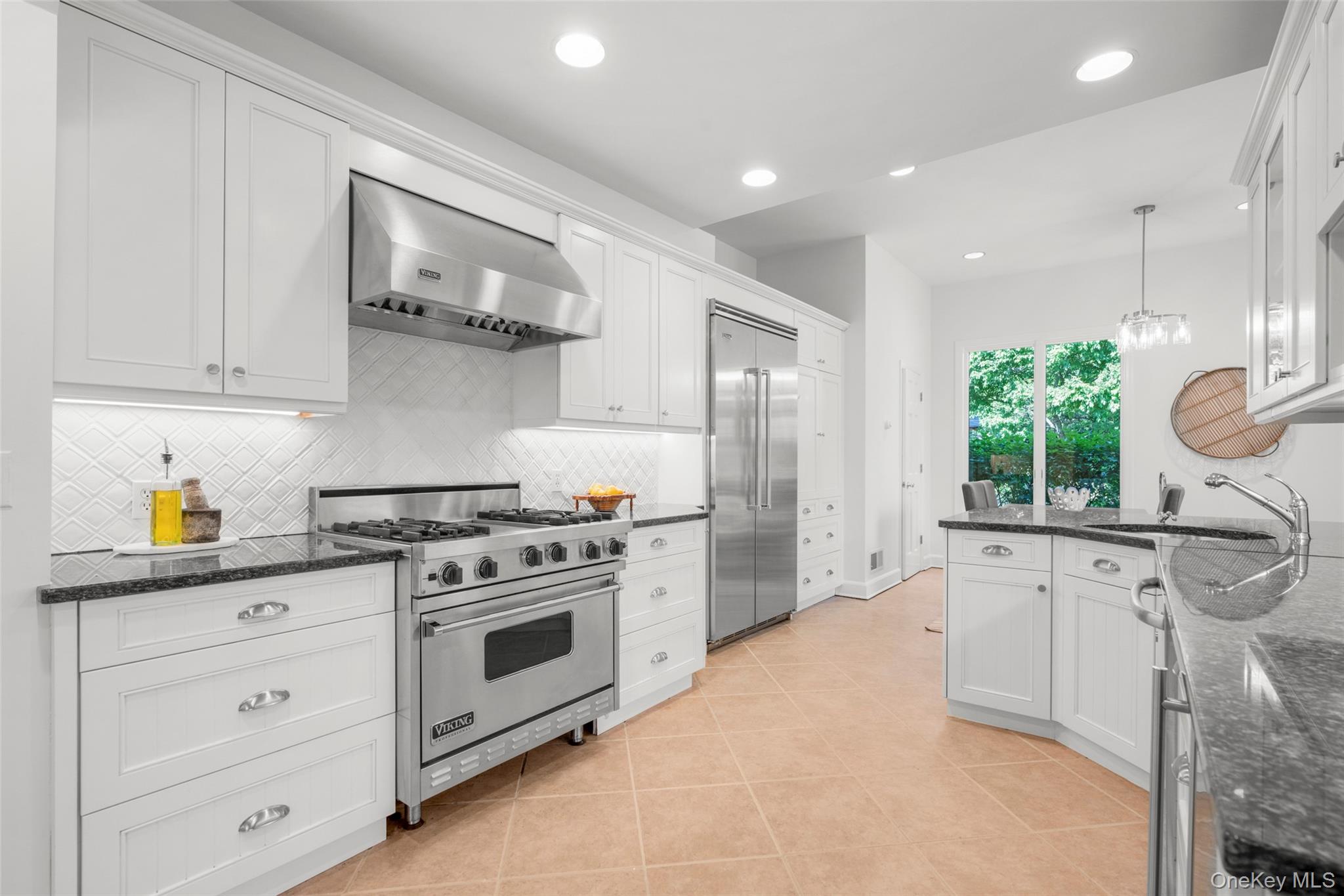 63 Rye Road Rye, NY 10580 - Photo 11 of 50 Stone countertops, Viking appliances, built in water filter, and a wine fridge.