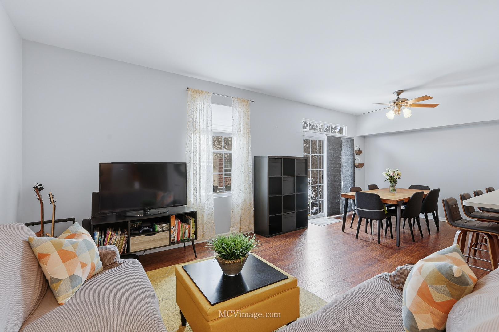 16414 Willow Walk Drive Lockport, IL 60441 - Photo 6 of 30 a living room with furniture and a flat screen tv