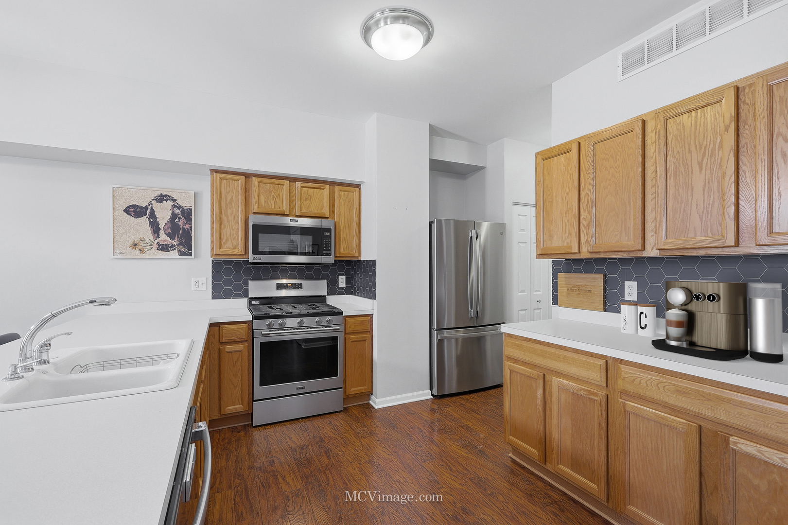 16414 Willow Walk Drive Lockport, IL 60441 - Photo 9 of 30 a kitchen with stainless steel appliances granite countertop a refrigerator stove and sink