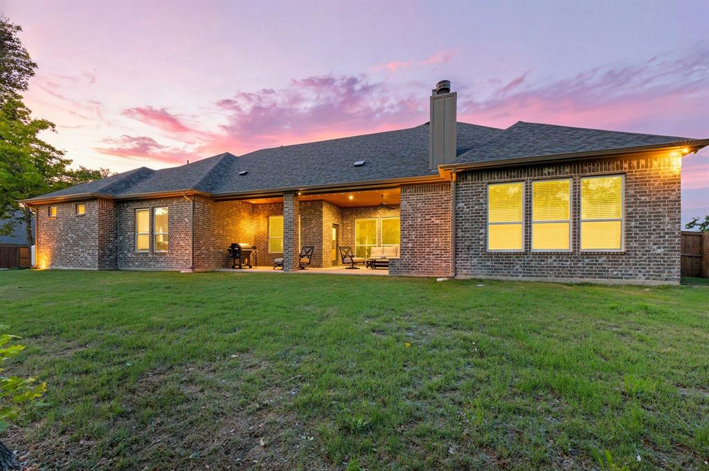 200 Clayton Crossing Springtown, TX 76082 - Photo 40 of 40 a front view of a house with a yard and garage
