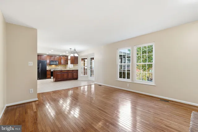 a view of a living room with furniture and window