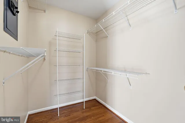 a view of a room with wooden floor