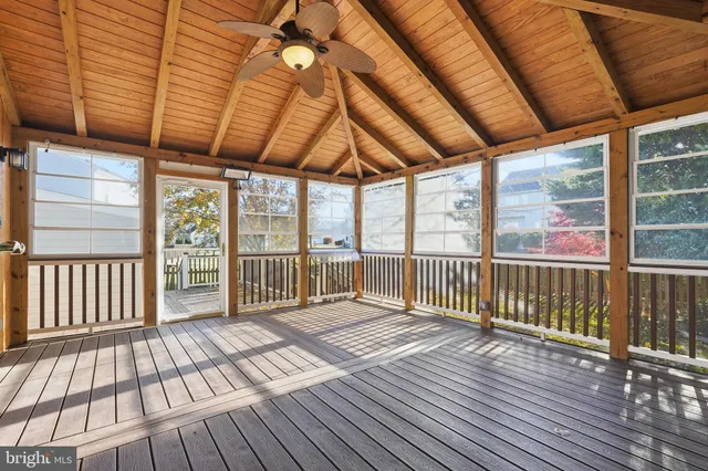 a view of porch with wooden floor