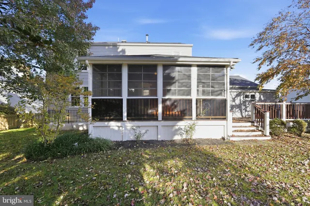 a front view of a house with a large window